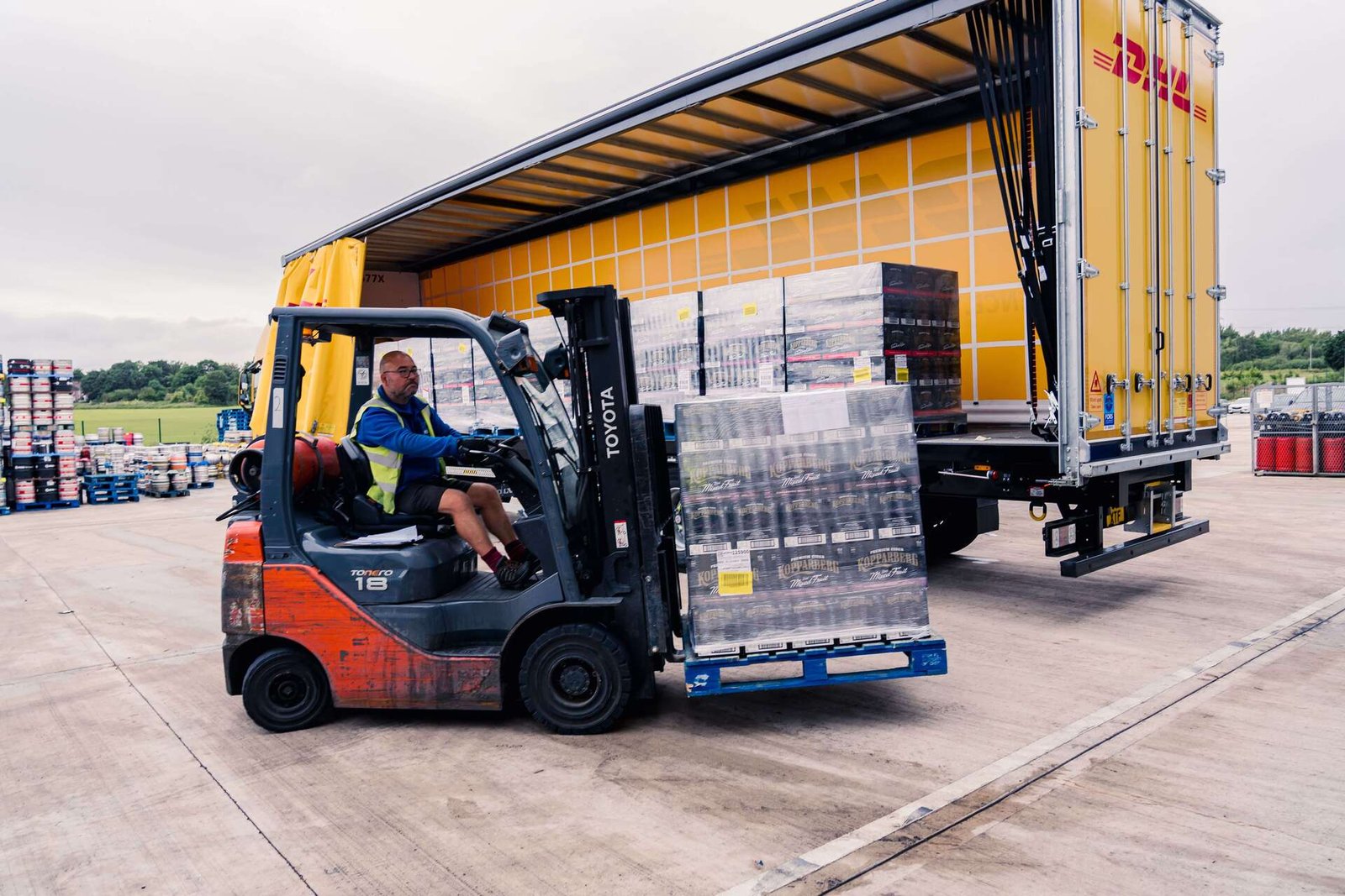 Two retail workers stocking shelves in a grocery store